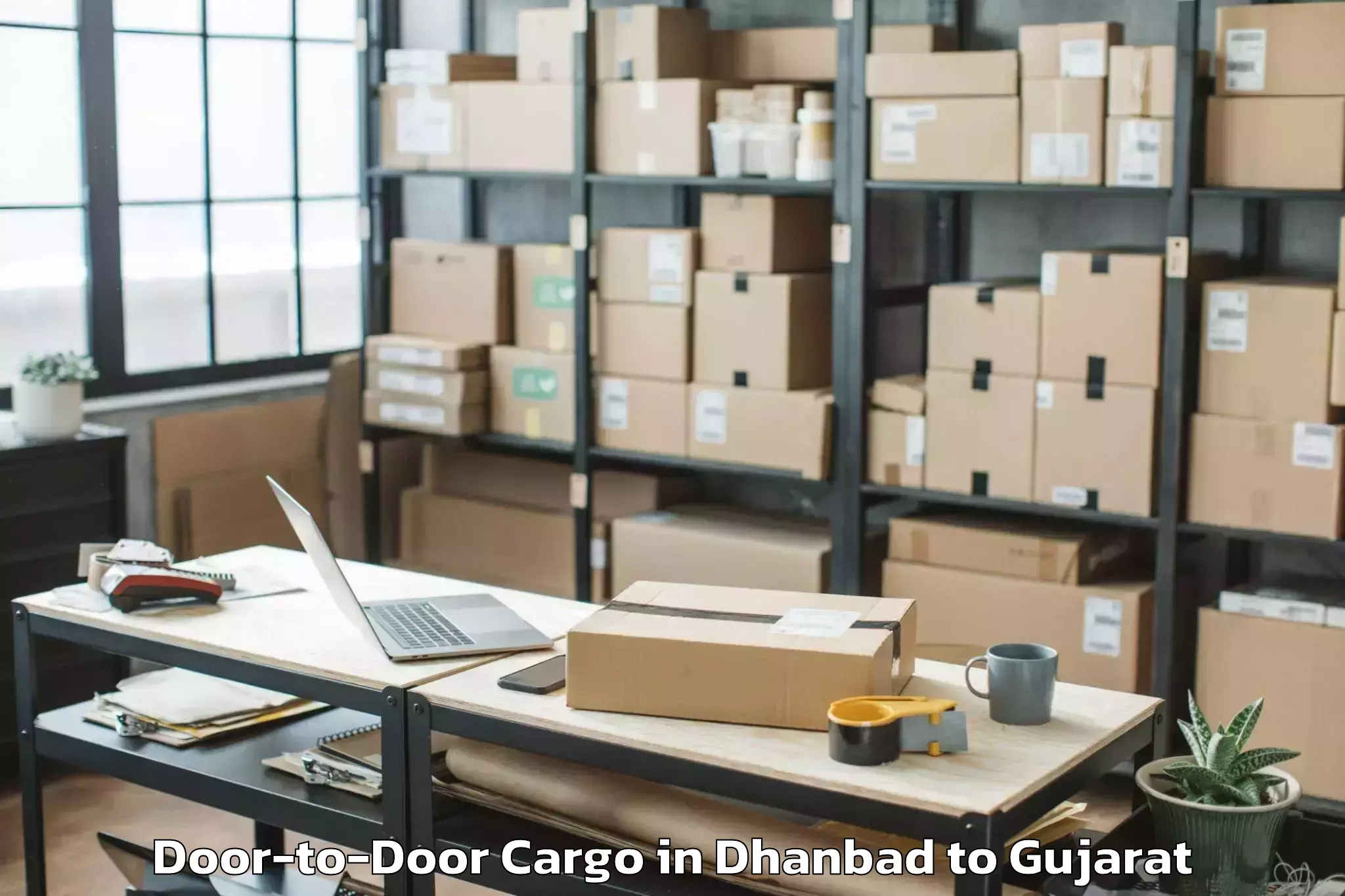 Trusted Dhanbad to Mahudha Door To Door Cargo